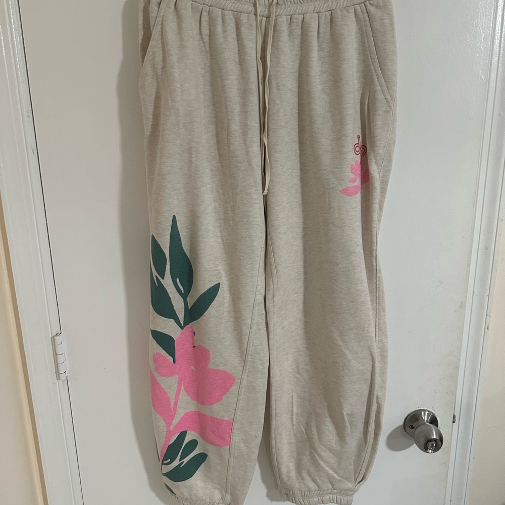 Anthropologie Cream Joggers with Pink and Green Leaf Design